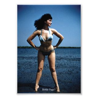Bettie Page in a Blue Bikini Standing Beside Water Photograph