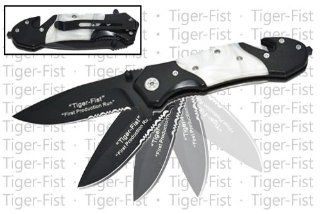 RS 911 B. 8" "Tiger Fist" Trigger Assisted Knife   White Pearl Jump into action with your fists swaying! These Tiger Fist knifes are nothing to play with. The half serrated blade and the seat belt cutter and skull crusher folding knife blade