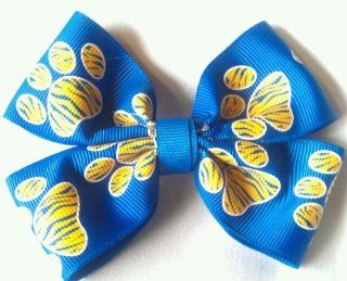 Bow   ROYAL BLUE & GOLD Zebra Paw Print   3 Inch Double Boutique Bow   On Alligator Clip     Check Out My Other Items   Great for School or Party Favors, SHOW YOUR TEAM SPIRIT  ***** Also Available in Bow Key Chain **** Different Colors Available  O