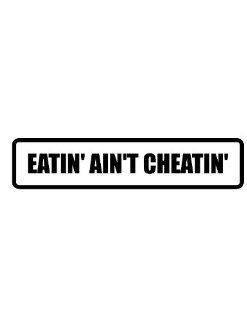 6" wide EATIN' AIN'T CHEATIN' . Printed funny saying bumper sticker decal for any smooth surface such as windows bumpers laptops or any smooth surface. 