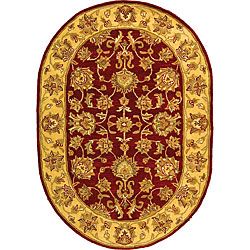 Handmade Heritage Kerman Red/ Gold Wool Rug (46 X 66 Oval)
