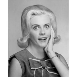 Portrait of a young woman looking surprised Poster Print (18 x 24)